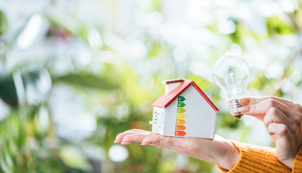 Home displaying epc energy rating scale next to a lightbulb