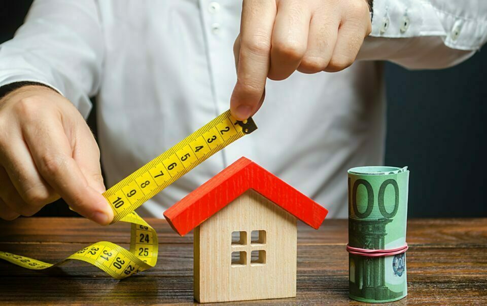 Measuring a scale model of a home for valuation